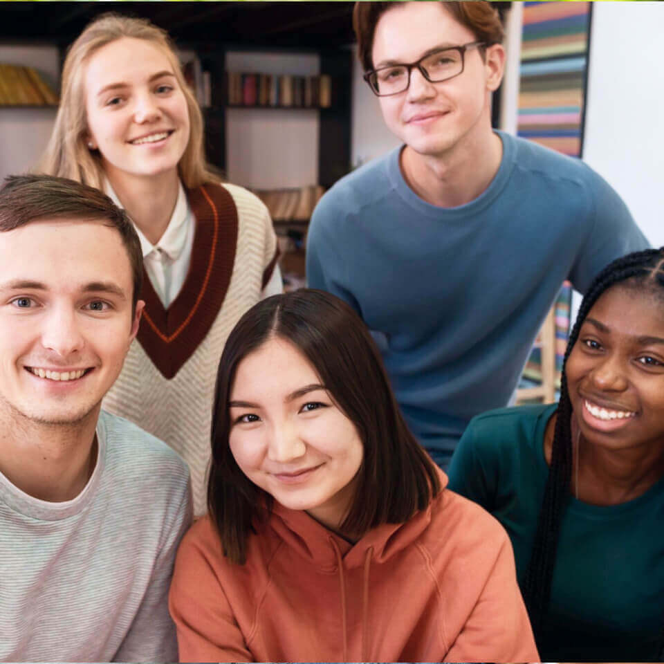 A group of university students who are gathered together and appear engaged and content